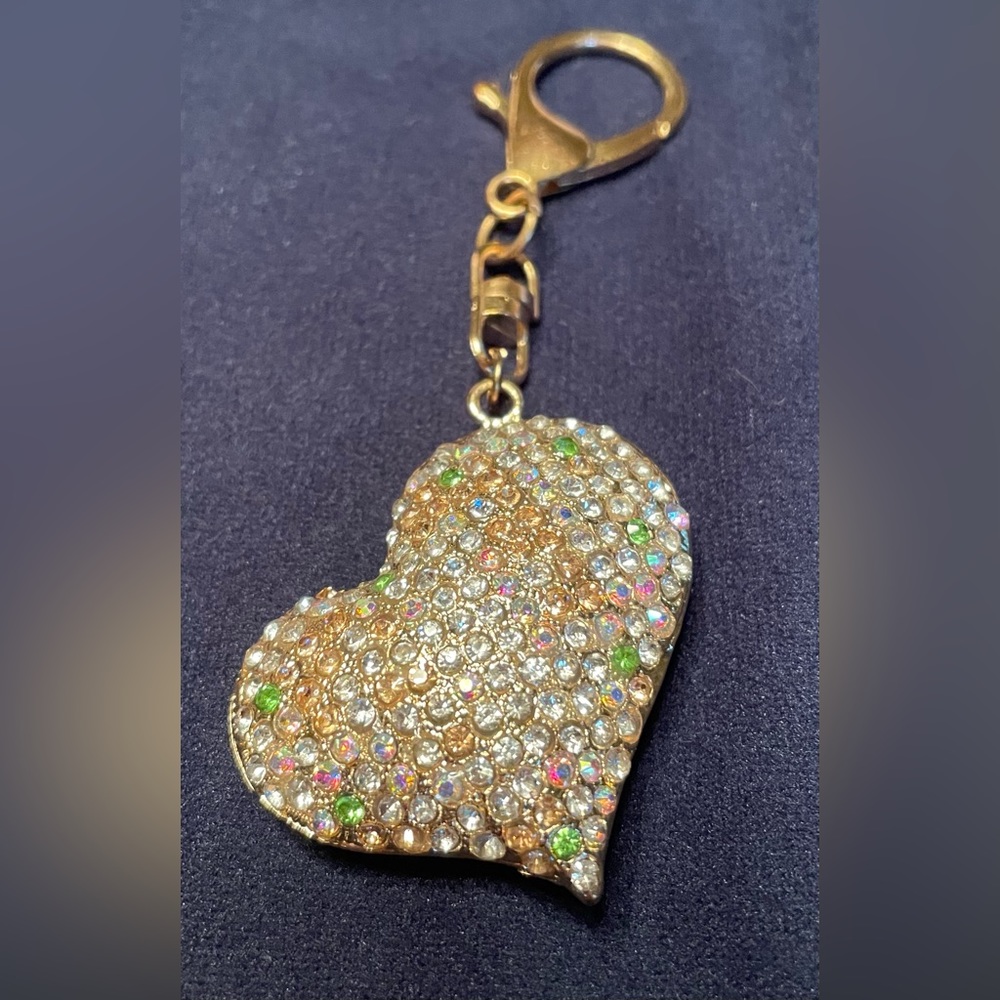 Puffed heart keychain/purse charm. Gold colored hardware with AB stones.